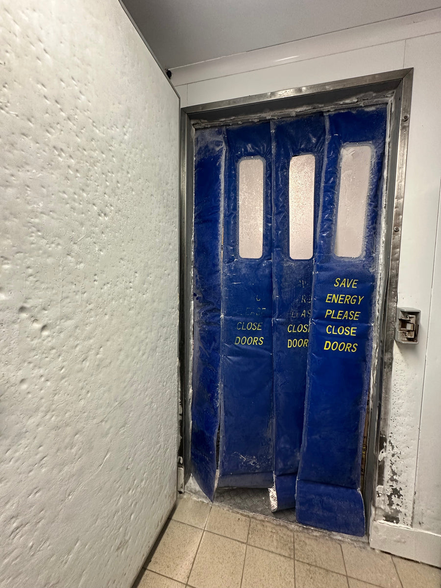 freezer coldroom door in open position showing damage and ice build up