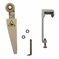 Mechanical components including a large blade, smaller parts, and a warning label on a white background.