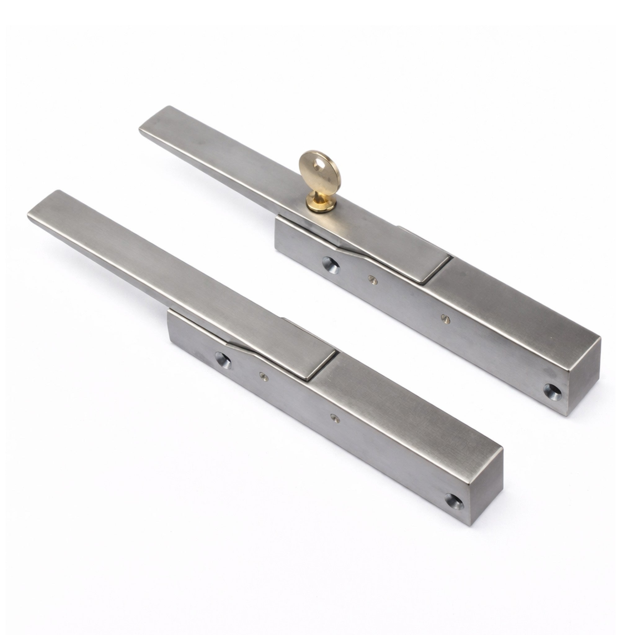 Pair of metallic door handles on a white background