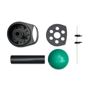 Set of mechanical components including a black pulley system, green ball, and other parts on a white background