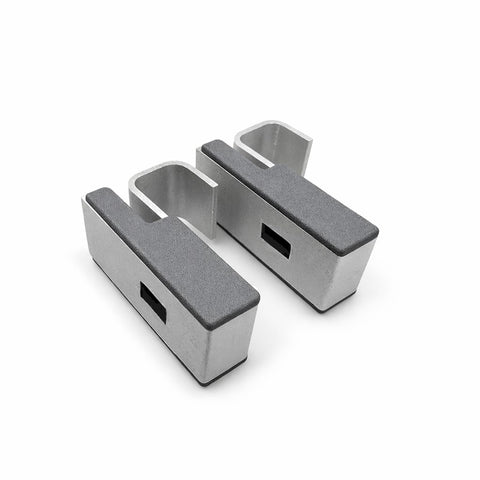 Two metallic brackets on a white background. Fermod corner connectors.