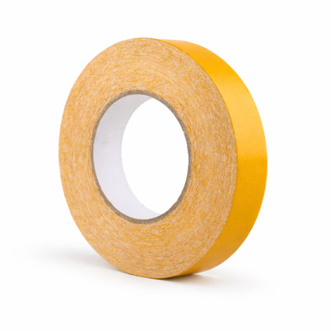 Roll of yellow double-sided tape on a white background
